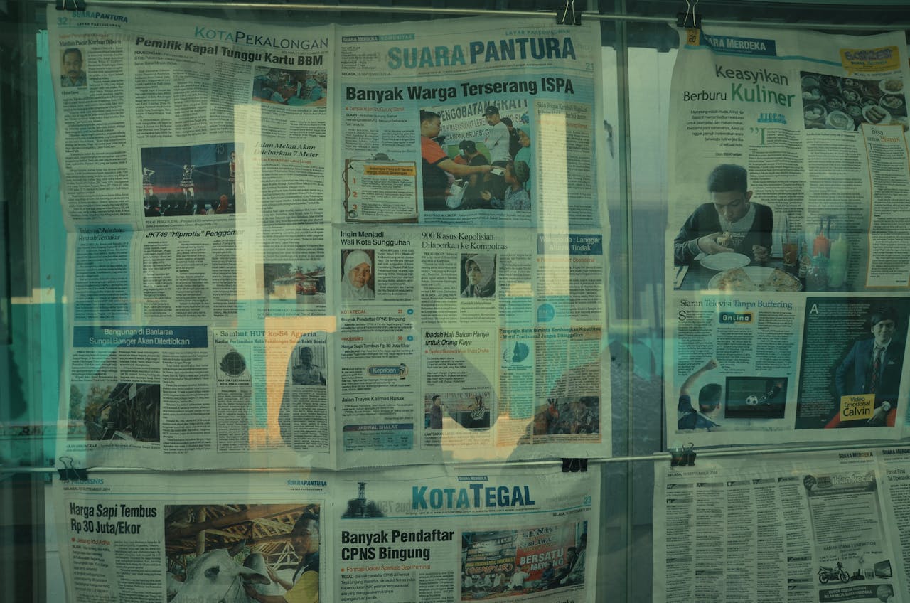 Detailed view of various newspapers on display in Jakarta, Indonesia.